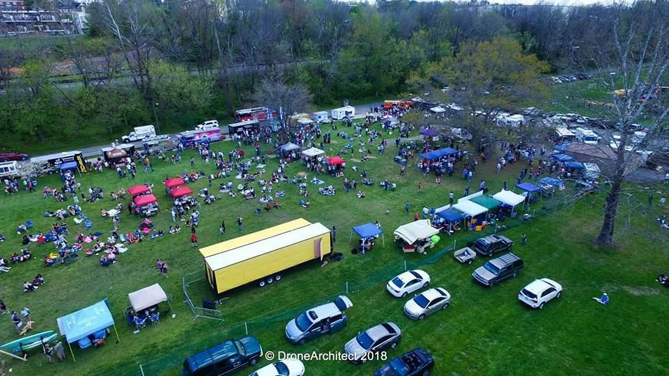 Aerial view of outdoor festival with vendor tents