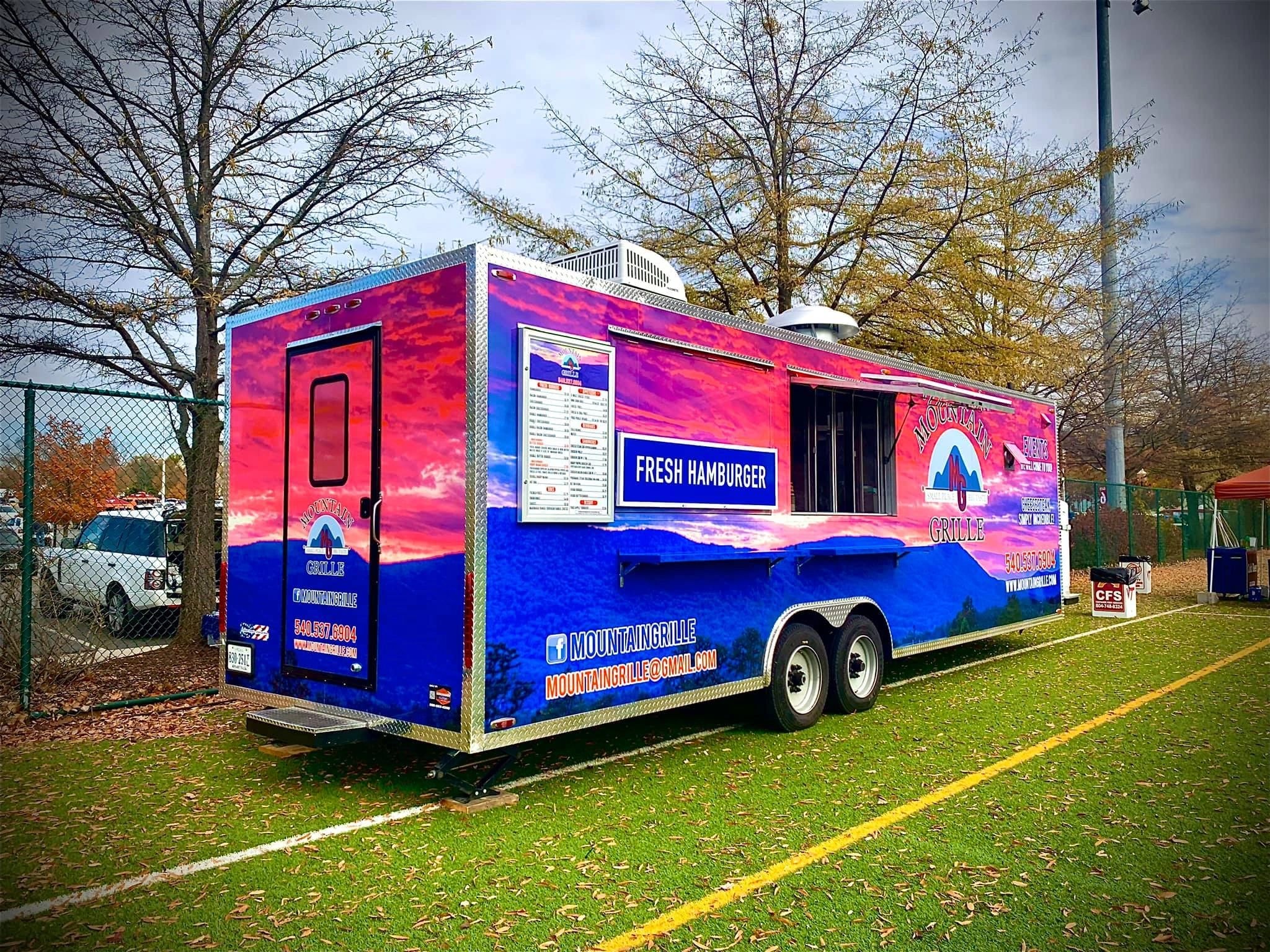 Mountain Grille food truck parked in autumn